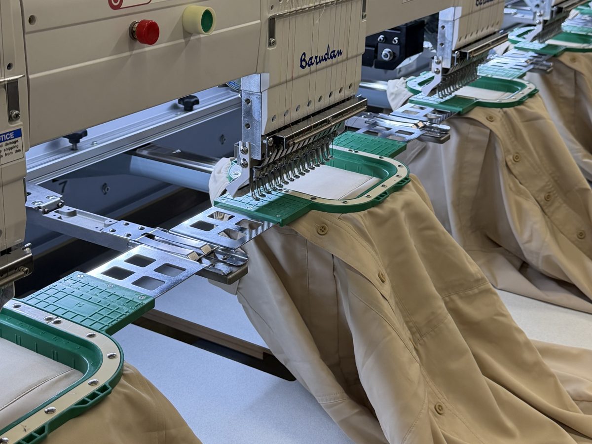 Embroidery machines stitching shirts